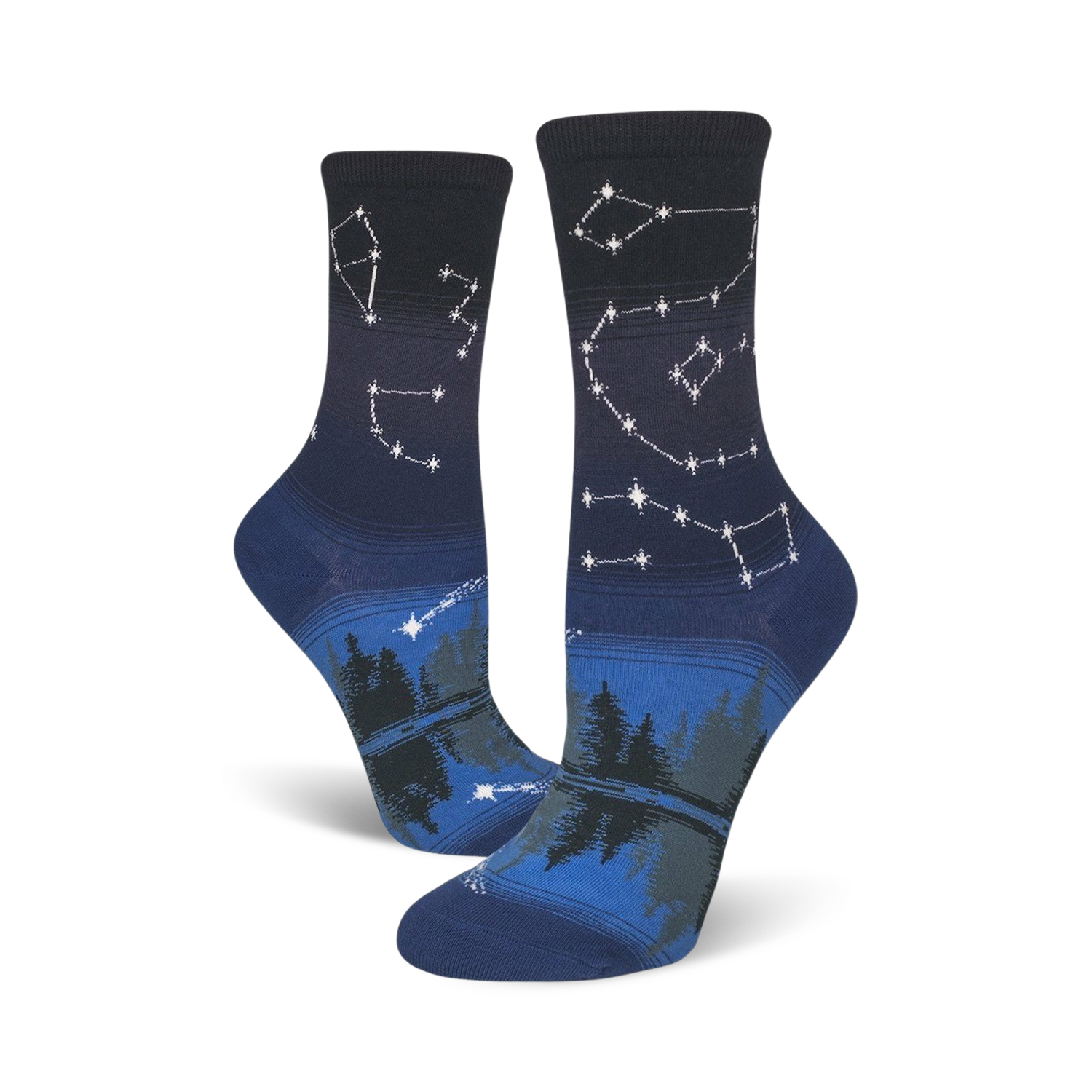 Pair of crew socks in navy blue and dark grey. Features a night sky design with constellations and a forest reflection.