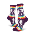 Crew socks in purple with white unicorns, rainbow stripes, snowflakes, and small pine trees. Fun and festive!