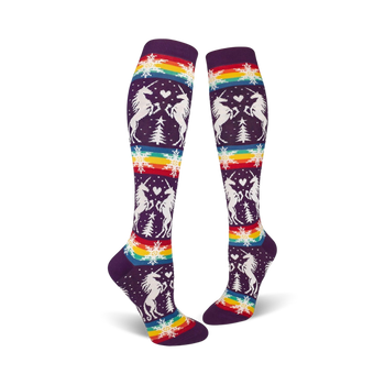 purple knee high socks featuring white unicorns, hearts, snowflakes, and rainbow designs.   