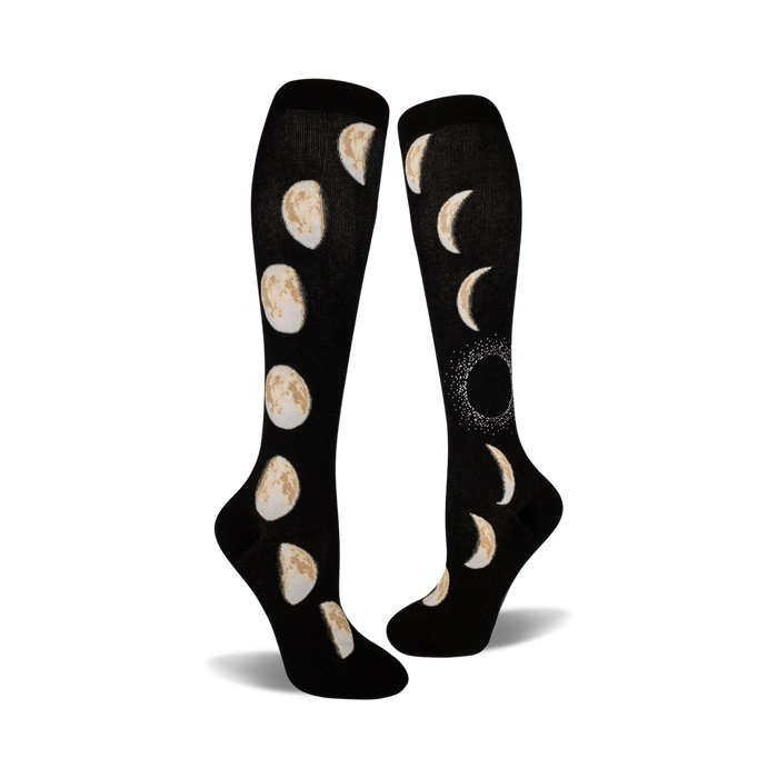 black knee-high socks feature a cream-colored pattern of moon phases, from new to full.   }}