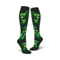 Pair of women's knee-high socks. Dark green background with bright green shamrock pattern. Festive and fun.