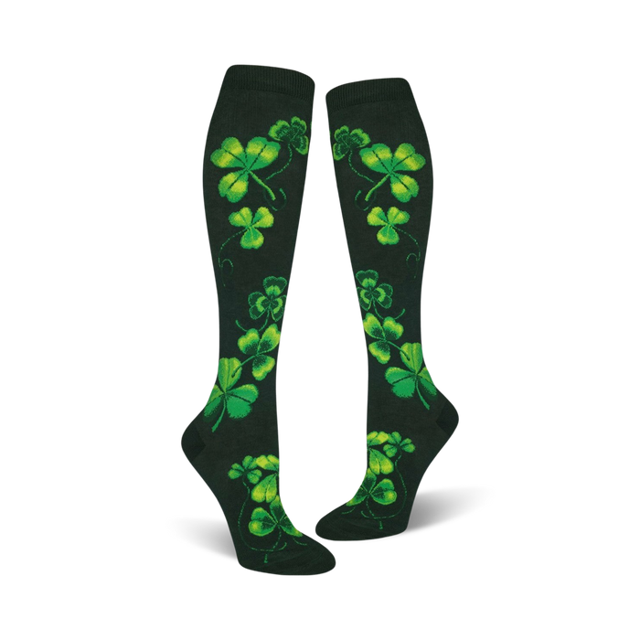 women's knee high shamrock socks featuring a bright green four-leaf clover design on a dark green background. perfect for st. patrick's day.   }}