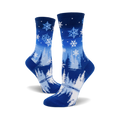 Pair of blue crew socks with a snowflake and pine tree design.  The socks are predominantly blue with white snowflakes and stylized trees.