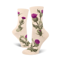 Cream crew socks adorned with a repeating pattern of purple and green thistles. Botanical illustration style.