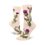 Cream crew socks adorned with a repeating pattern of purple and green thistles. Botanical illustration style.