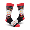 Pair of black crew socks with a red cuff.  The design features a plate of eggs and bacon with the text 'Resting Brunch Face' and '24 hours'.