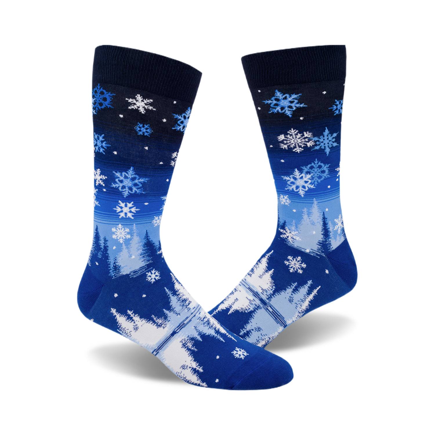 A pair of blue crew socks with a wintery design.  The socks feature white snowflakes and stylized trees on a blue and navy gradient background.