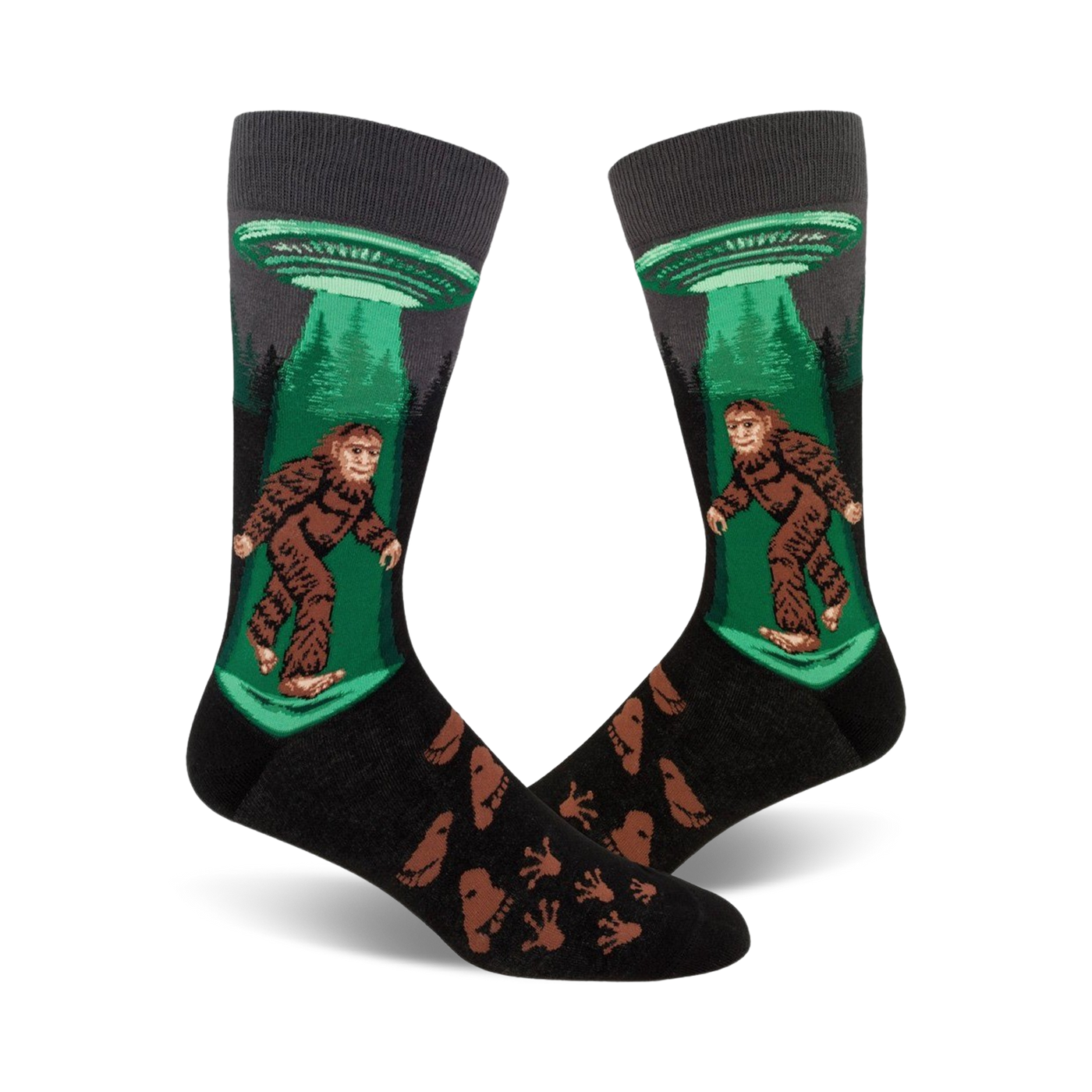 Crew socks in black, green, and brown featuring Bigfoot being beamed up by a UFO.  Footprints are printed on the lower part of the sock.