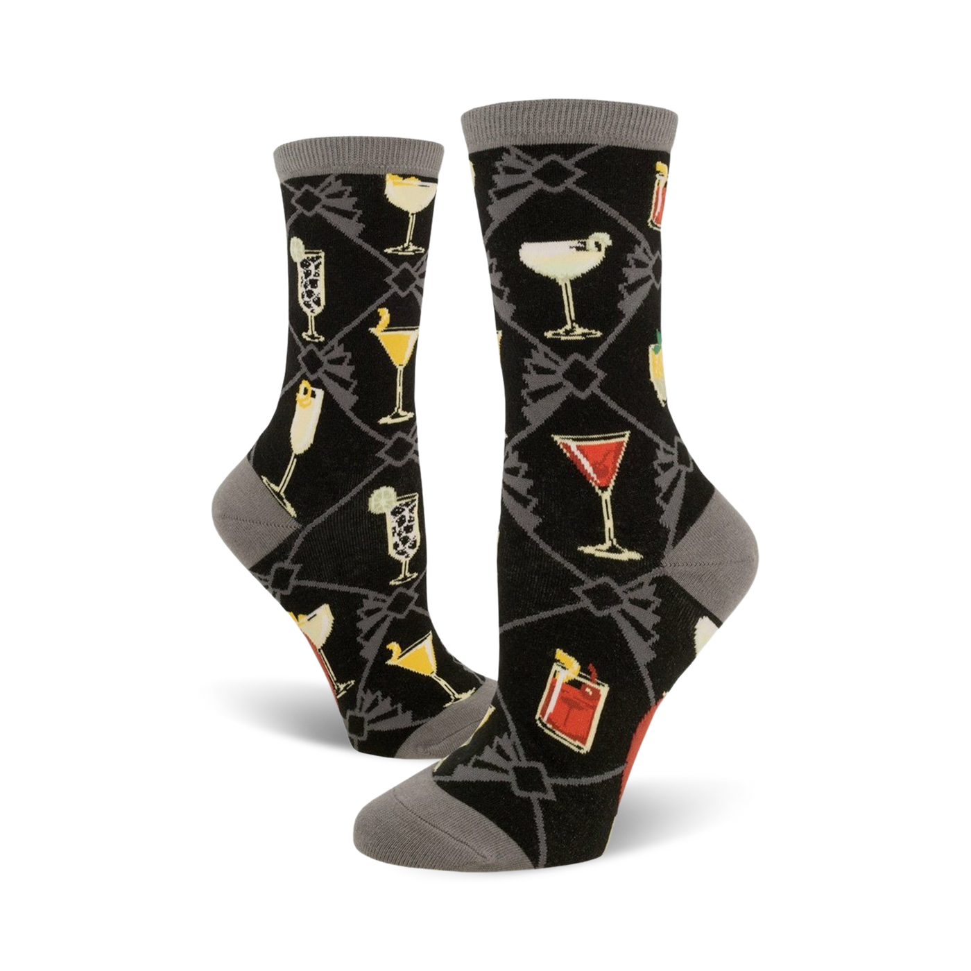 A pair of women's crew socks in black with a gray cuff. The socks feature a pattern of colorful cocktail illustrations set against a dark background.