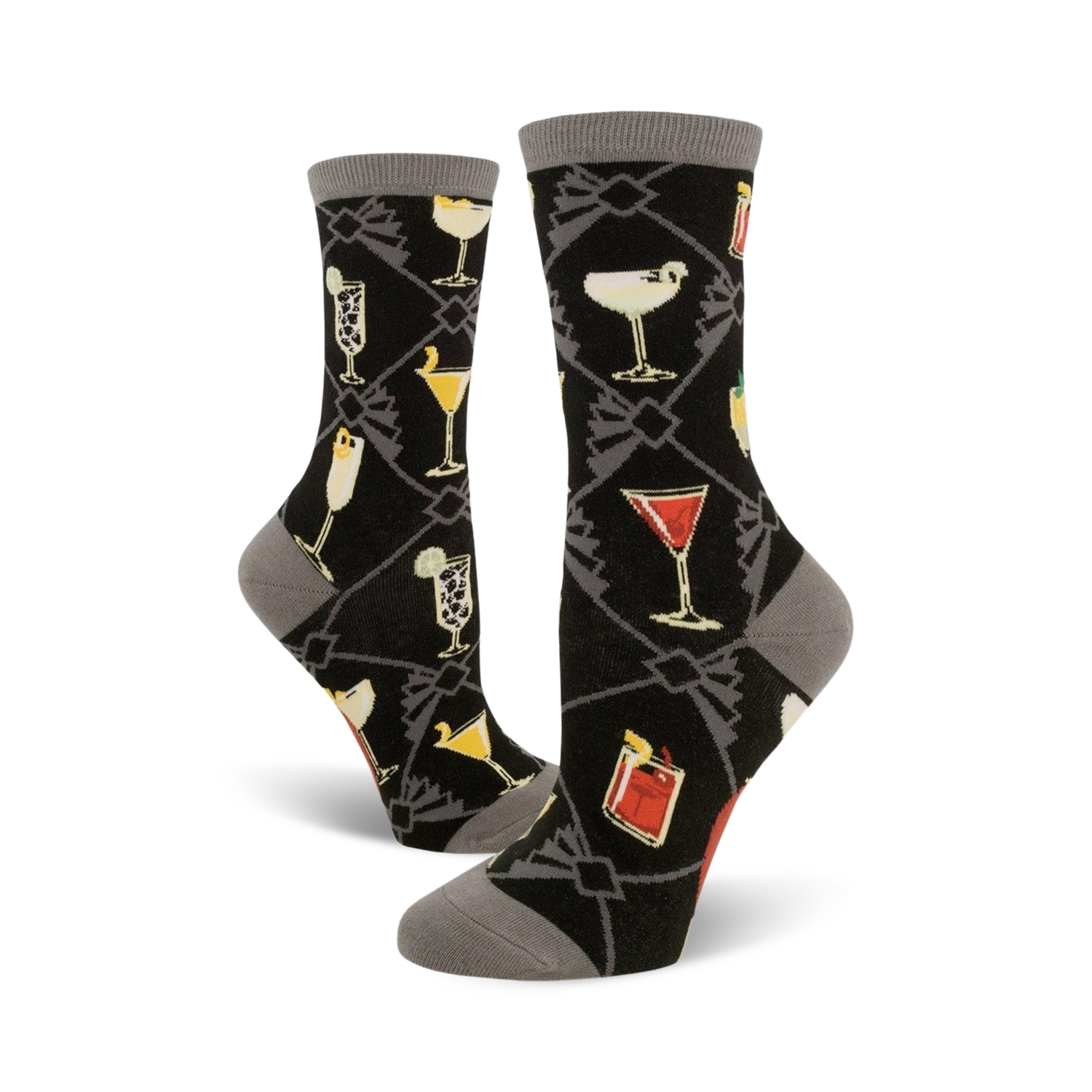 A pair of women's crew socks in black with a gray cuff. The socks feature a pattern of colorful cocktail illustrations set against a dark background.