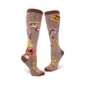 Pair of knee-high socks in brown and beige, featuring a whimsical illustration of various mushrooms and a wood-grain pattern.