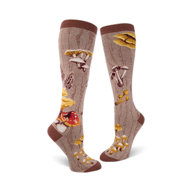 brown knee-high socks with ribbed cuff and reinforced toe and heel. pattern of various mushrooms in shades of brown, yellow, and red. perfect for women who love nature-inspired fashion.    