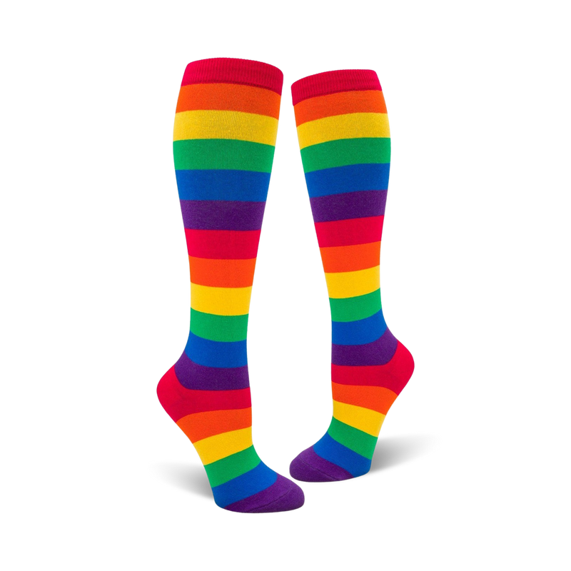 Pair of rainbow striped knee-high socks.  Features red, orange, yellow, green, blue, indigo, and violet stripes.
