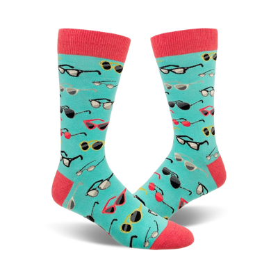 light blue mens crew socks with a cartoon sunglasses pattern in stylish summer color palette.  