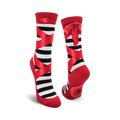 A pair of black and red striped ballet slipper socks with red ribbons and bows. Fun and whimsical design.
