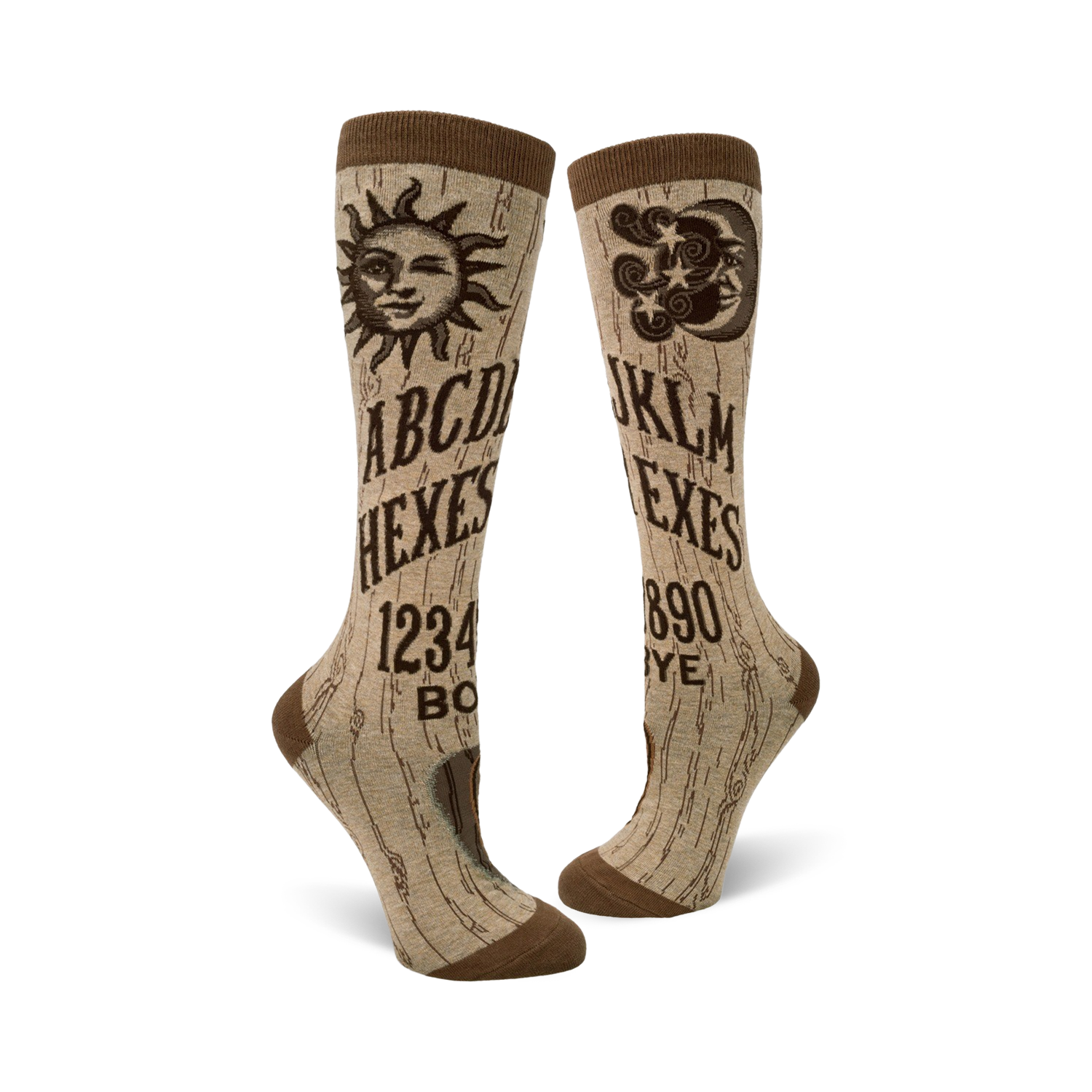 A pair of beige knee-high socks with a brown Ouija board design. The socks feature a sun, moon, and alphabet graphics.
