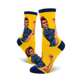 Crew socks in yellow with navy blue cuffs, featuring a repeated image of Rosie the Riveter flexing her bicep.