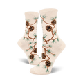 Cream crew socks with a repeating pattern of brown pinecones and green pine branches. Nature-inspired design.