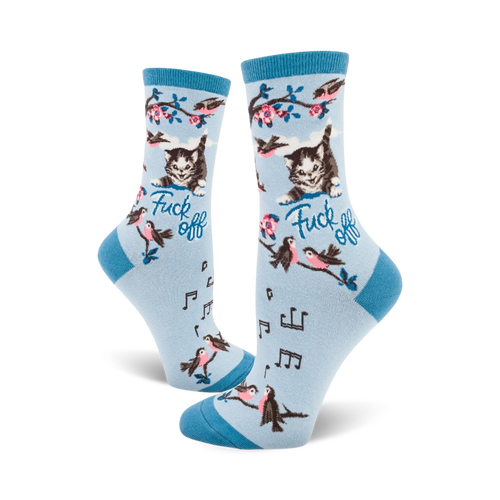 Crew socks in light blue with a cute kitty, birds, musical notes, and the phrase 'Fuck Off' printed on them.