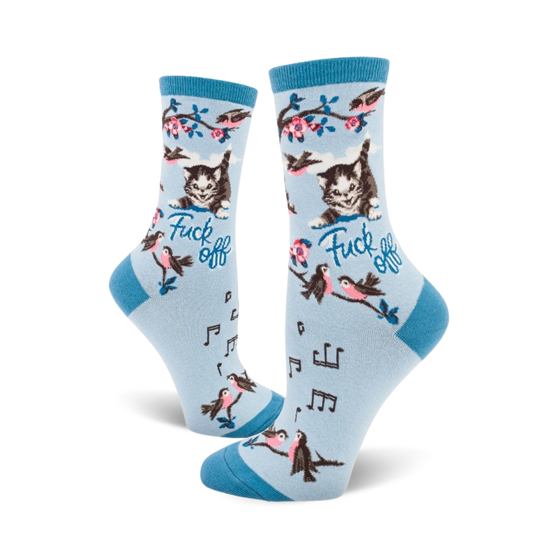 Crew socks in light blue with a cute kitty, birds, musical notes, and the phrase 'Fuck Off' printed on them.
