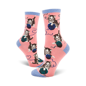 women's crew length novelty socks in pink with gray kittens playing with blue yarn balls.  