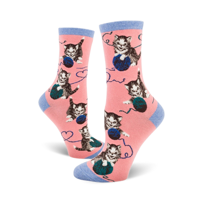 women's crew length novelty socks in pink with gray kittens playing with blue yarn balls.  