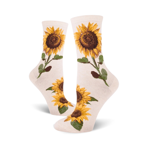 Cream crew socks with yellow and brown sunflower designs.  Sunflowers are depicted with stems and leaves on a cream background.