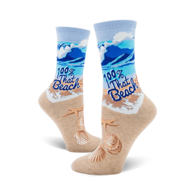  light blue crew socks with blue waves, starfish and seashells, and tan shore printed on fabric. caption "100% that beach."  