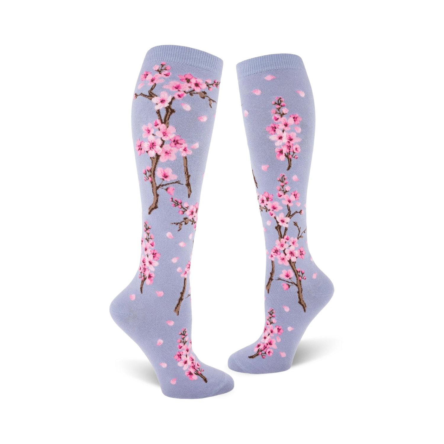 Lifestyle shot showing the blue Cherry Blossom knee-high socks on a model's legs.