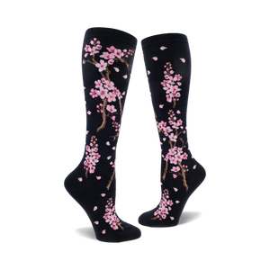 black knee-high women's socks with pink cherry blossom and falling petal design.  