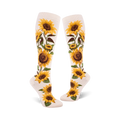 Pair of cream and yellow knee-high socks with a sunflower print. The sunflowers are realistically rendered with brown centers and green leaves.