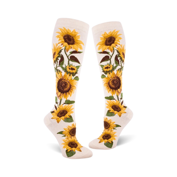 white knee high women's socks with yellow, orange, and brown sunflower pattern.  