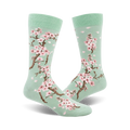 Pair of crew socks, mint green with pink cherry blossoms and petals.  Beautiful floral print.