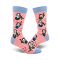 Pair of pink crew socks featuring repeated images of kittens batting at balls of yarn.  Socks have light blue cuffs.