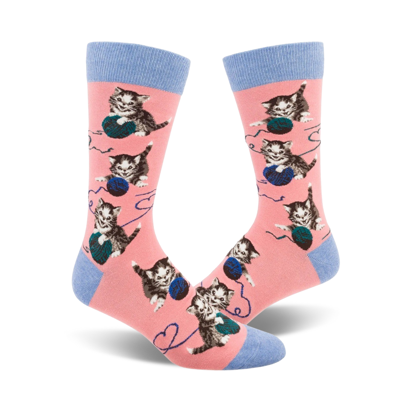 Pair of pink crew socks featuring repeated images of kittens batting at balls of yarn.  Socks have light blue cuffs.