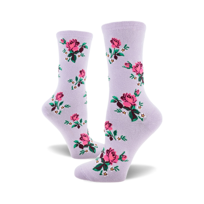 socks that are purple with a pattern of pink roses, green leaves, and white flowers.