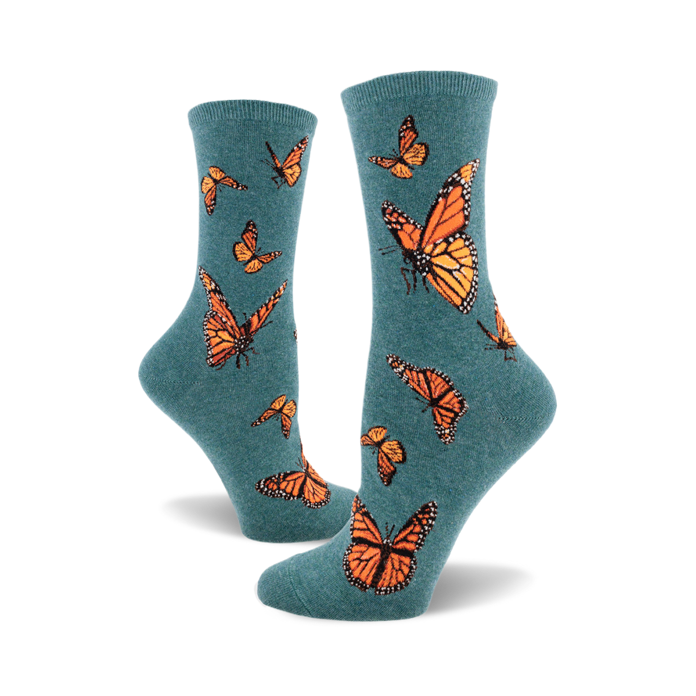 A pair of teal crew socks featuring a pattern of orange monarch butterflies. The socks are shown from the side, showcasing the design.
