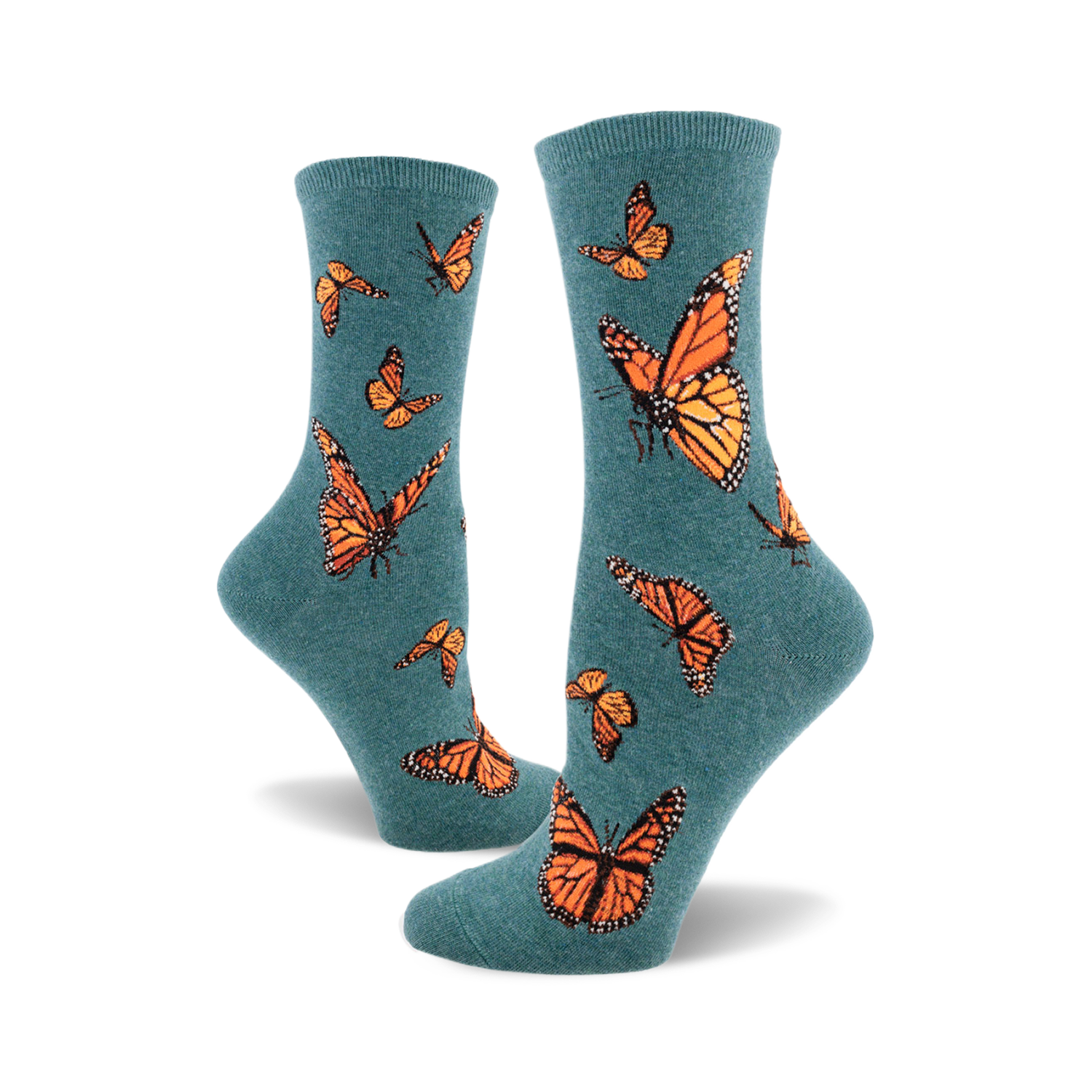 A pair of teal crew socks featuring a pattern of orange monarch butterflies. The socks are shown from the side, showcasing the design.