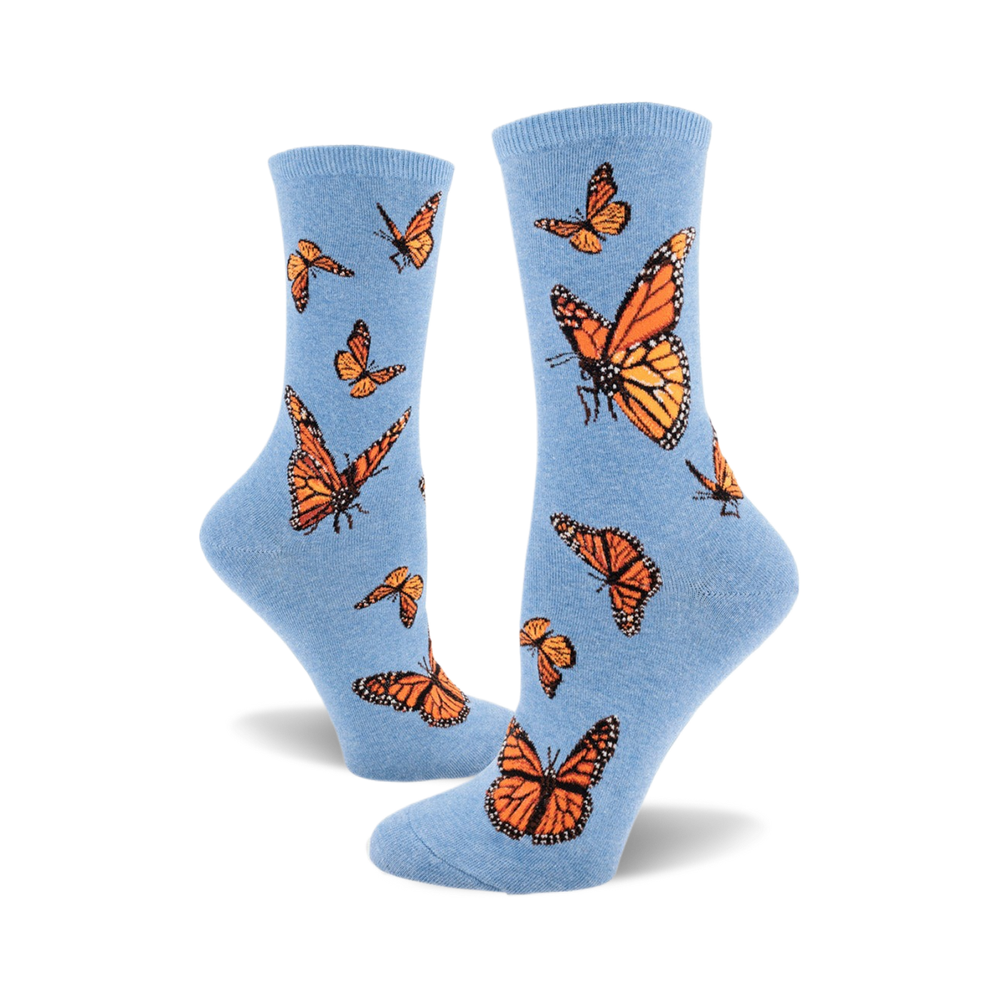 A pair of light blue crew socks adorned with a pattern of orange monarch butterflies. The socks are shown from the side, one sock partially obscuring the other.