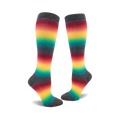 Pair of knee-high socks with horizontal rainbow stripes on a charcoal grey background.  The colors include red, orange, yellow, green, and teal.