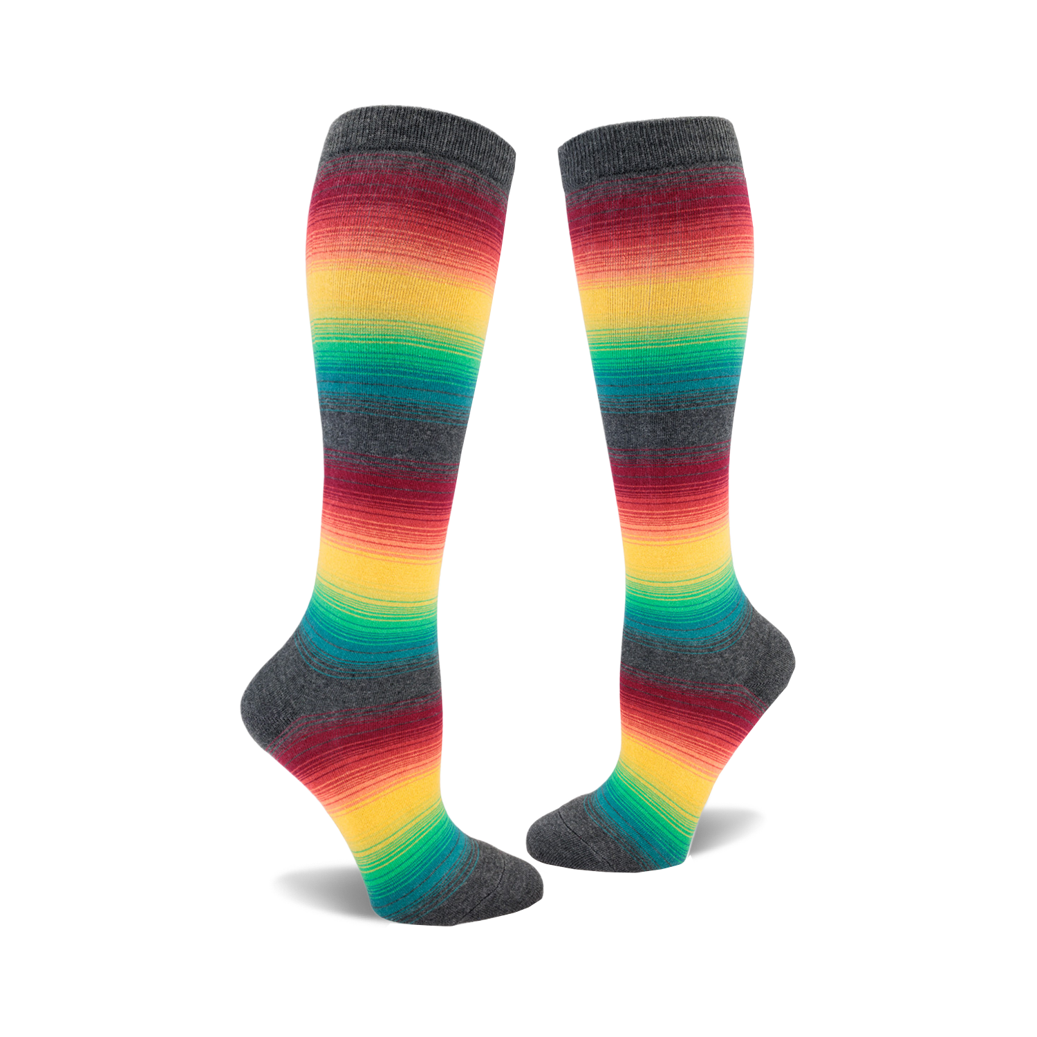 Pair of knee-high socks with horizontal rainbow stripes on a charcoal grey background.  The colors include red, orange, yellow, green, and teal.