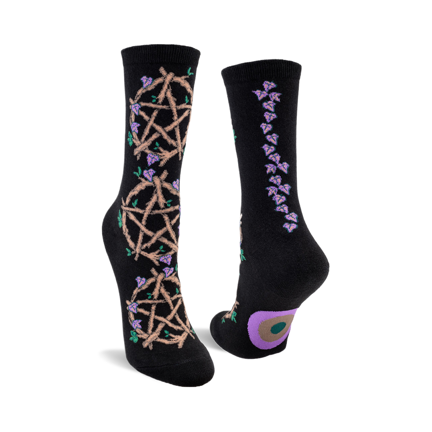 Black crew socks with a beige pentagram and purple flower design on one side and a line of purple flowers on the other.  A small circle design is on the heel.