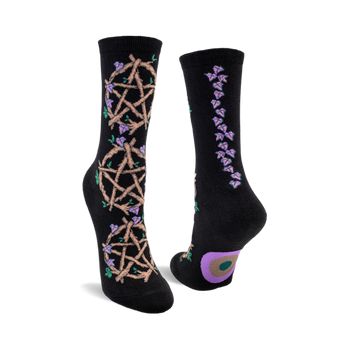 front view of black crew socks with a pentagram and vines on them.