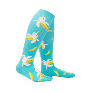 Lifestyle shot: Model wearing teal Bananarwhal knee-high socks, showcasing the fit and fun design.