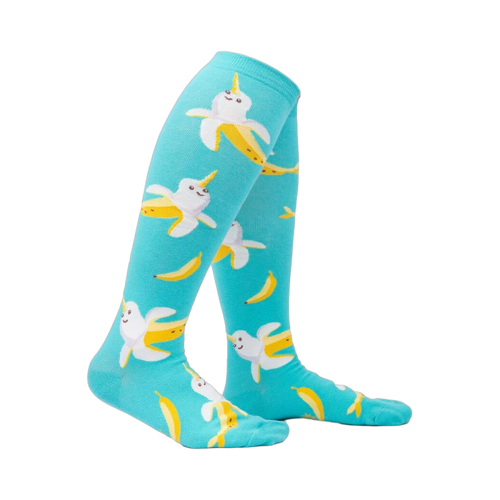 Lifestyle shot: Model wearing teal Bananarwhal knee-high socks, showcasing the fit and fun design.