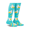 Pair of teal knee-high socks with a whimsical pattern of smiling banana-narwhals. 