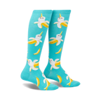 Pair of teal knee-high socks with a whimsical pattern of smiling banana-narwhals. 