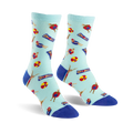 Pair of crew socks in light blue with a playful pattern of cartoon swimmers and beach balls in red, yellow, and dark blue.