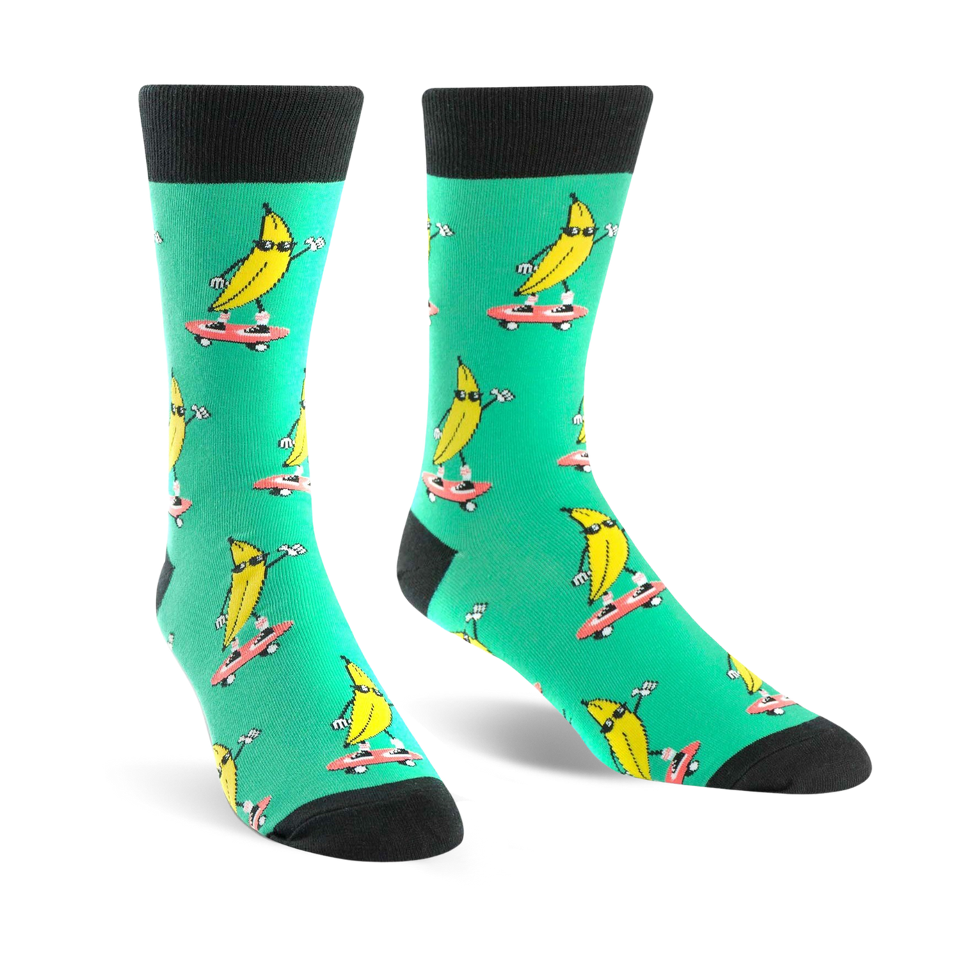 Crew socks in teal with a repeated pattern of yellow bananas skateboarding. Bananas wear sunglasses.