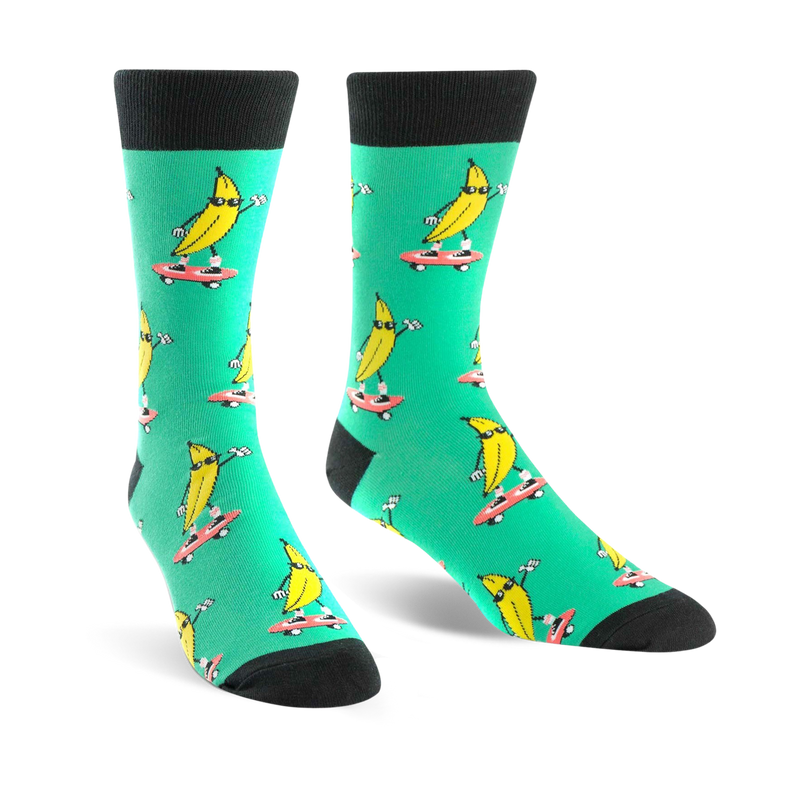 Crew socks in teal with a repeated pattern of yellow bananas skateboarding. Bananas wear sunglasses.